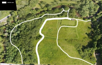 Up to two acres for vegetable or flower cultivation using organic methods. The existing building for tool storage and light processing is visible in the upper right of the aerial photo.