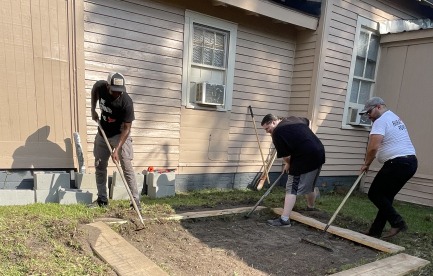 Myself and community members working on a raised garden bed for our community garden in Greenville