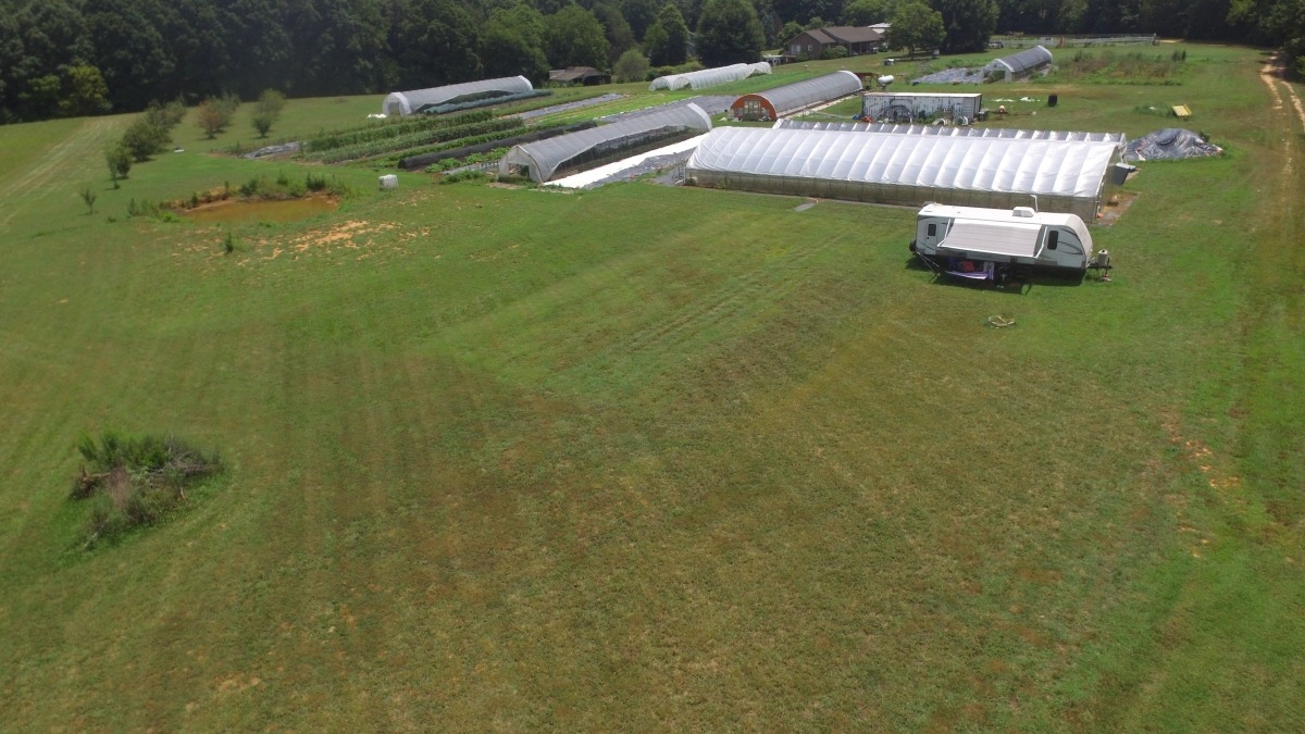 Greenhouse & employee RV.