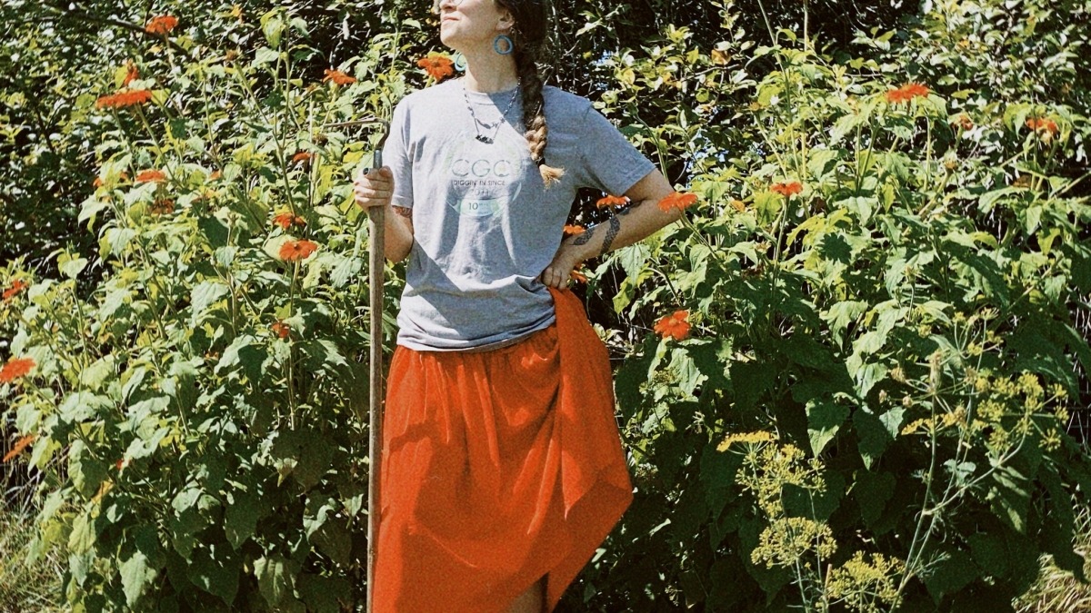 Emma standing by plants