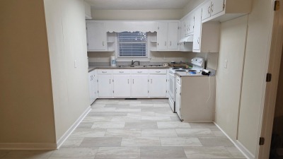 Shows new kitchen flooring
