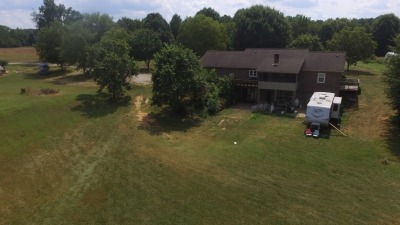 Rear view of house with second RV.