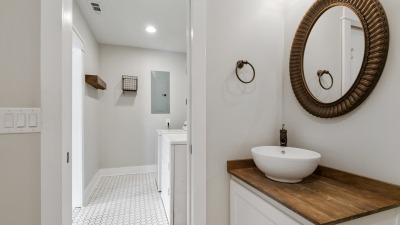 One of the bathrooms with a shower and toilet