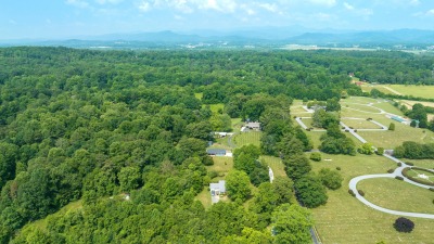 Aerial view of the house and the pasture behind it