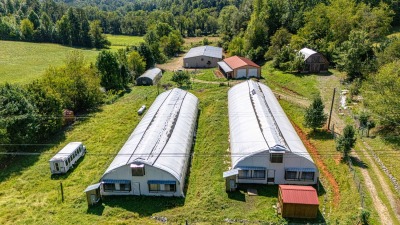 Two light deprivation greenhouses