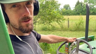 me in lower fields on tractor