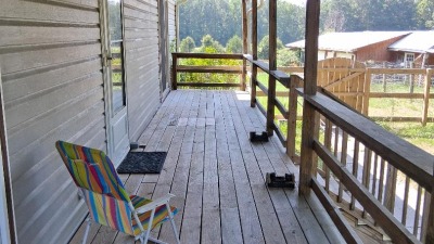 Back porch overlooking barn/outbuilding.
