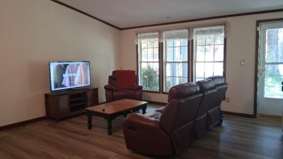 front og living room with a wall of windows