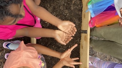 Students by a garden bed
