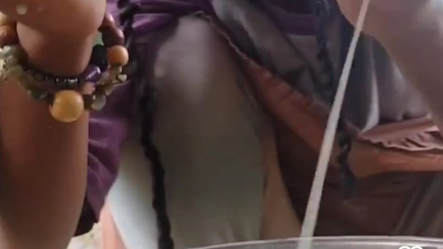 My daughter milking a cow..