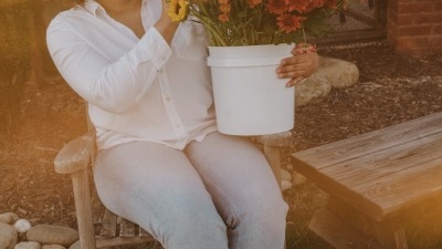 sorting through a bucket of flowers