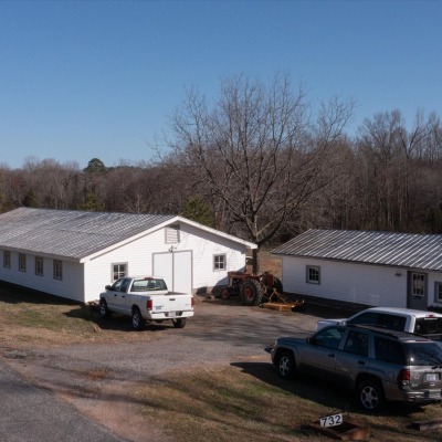 Workshop, silo, and retail kitchen with parking.