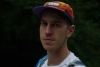 Close up of young man wearing an orange hat