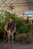 My dog and I in the greenhouse.