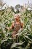 Blonde woman in corn field.