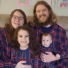 Nicholas DePaoli is shown with his wife, and two children, dressed in matching Christmas pajamas