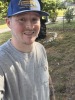 Portrait of Ronald Vergantino outdoors with a tree and grass in the background